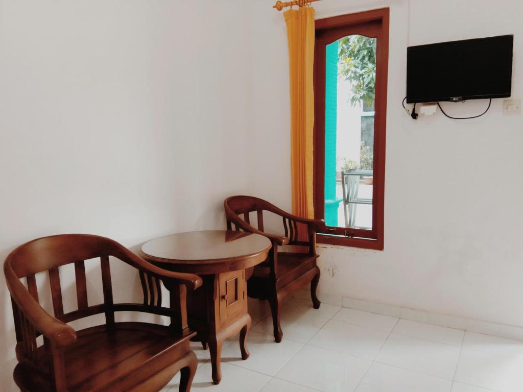 Televisyen dan/atau pusat hiburan di Tata Homestay Family