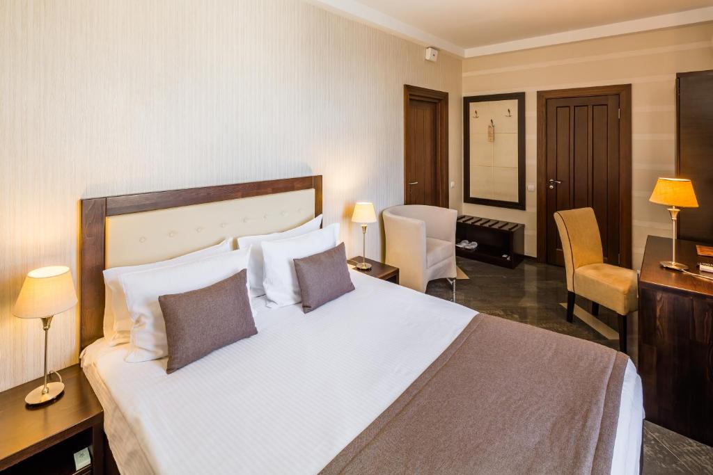 Ліжко або ліжка в номері Taurus Hotel & SPA