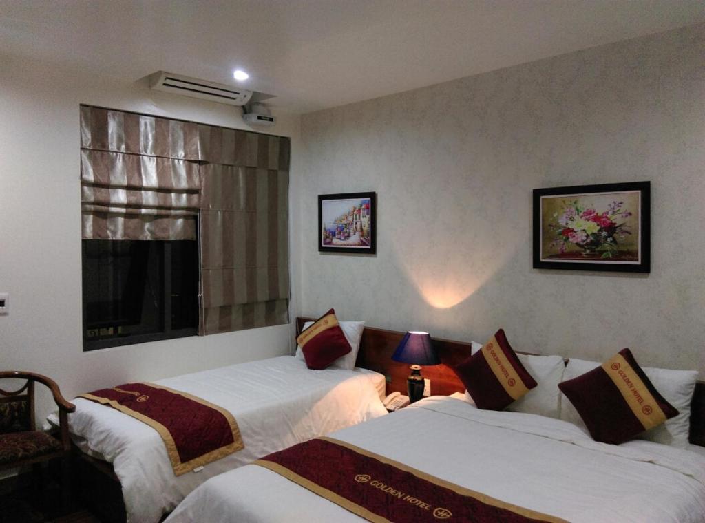 En eller flere senger på et rom på Golden Thai binh Hotel