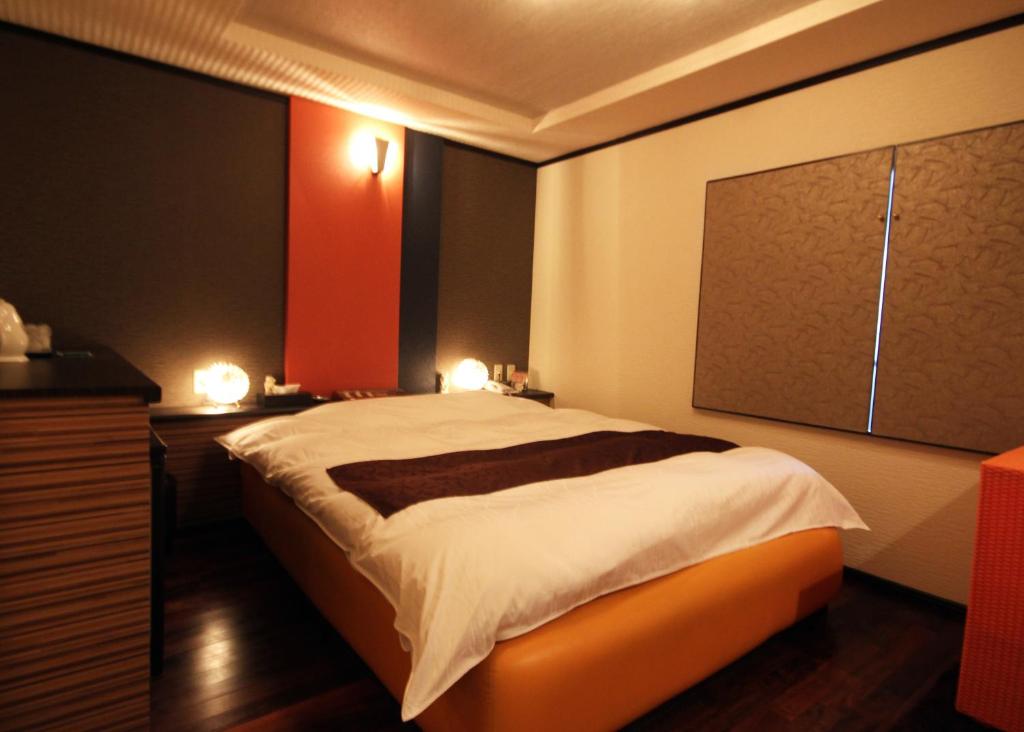 Postel nebo postele na pokoji v ubytování Hida Takayama Hotel Viera Resort (Adult Only)