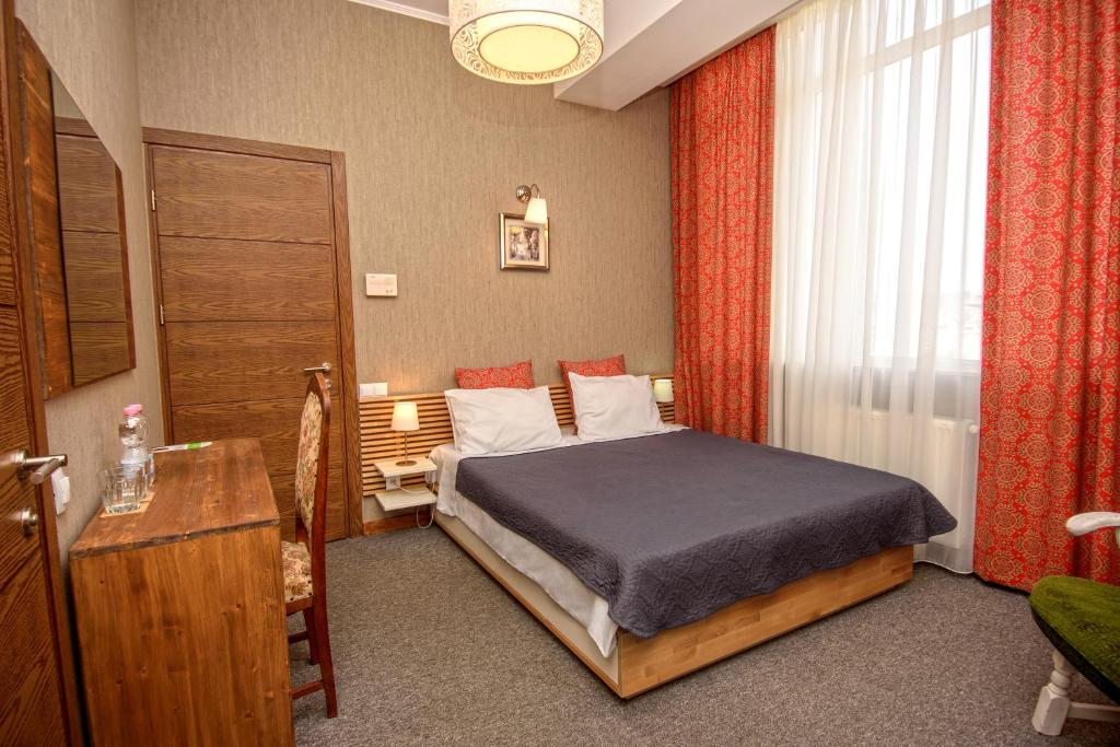 Postel nebo postele na pokoji v ubytování Hotel Libretto