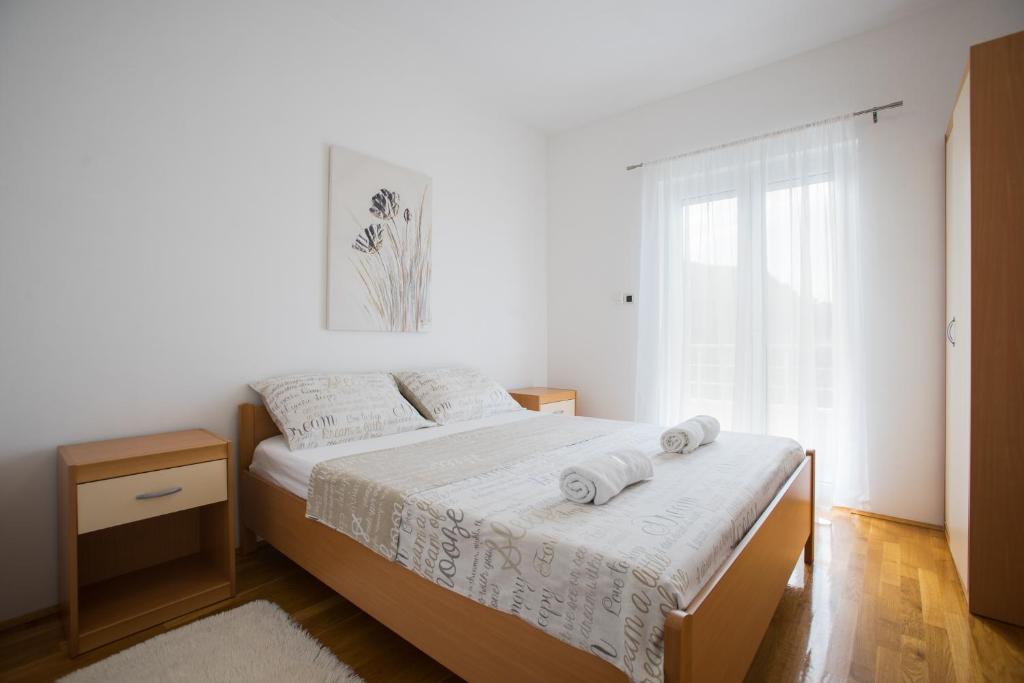 Postel nebo postele na pokoji v ubytování Apartment Toma