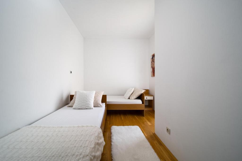 Postel nebo postele na pokoji v ubytování Apartment Toma