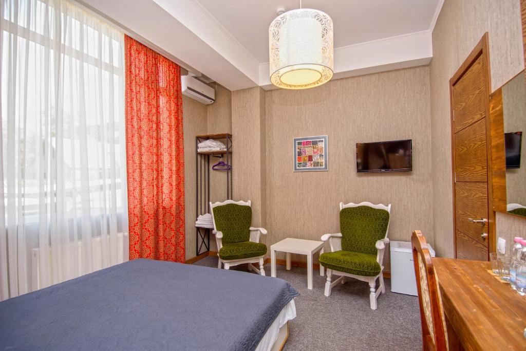 TV a/nebo společenská místnost v ubytování Hotel Libretto