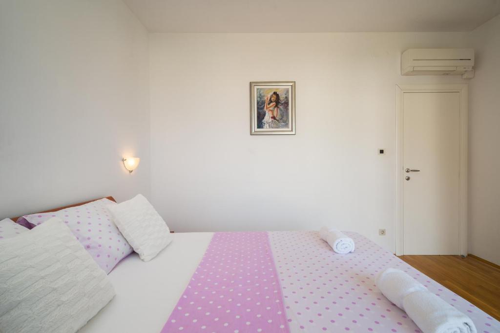 Postel nebo postele na pokoji v ubytování Apartment Toma