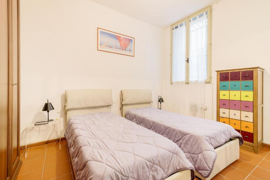 Posteľ alebo postele v izbe v ubytovaní Torre dell'Orologio Apartment