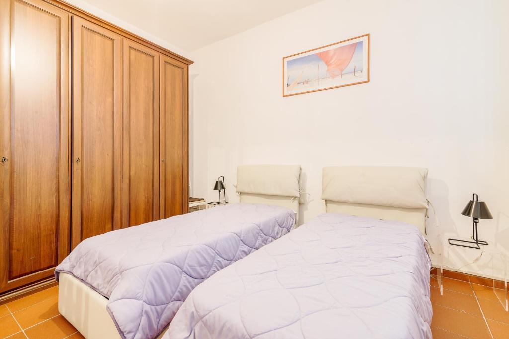Posteľ alebo postele v izbe v ubytovaní Torre dell'Orologio Apartment