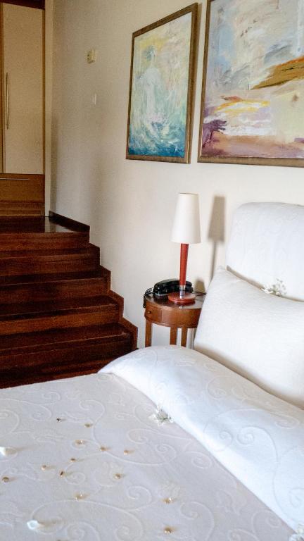 A bed or beds in a room at Villa Andromeda