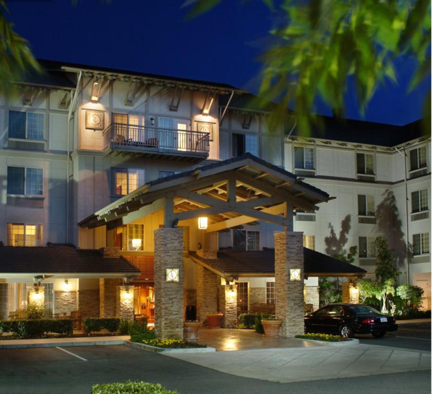 a hotel building with a car parked in front of it at Larkspur Landing Campbell-An All-Suite Hotel in Campbell