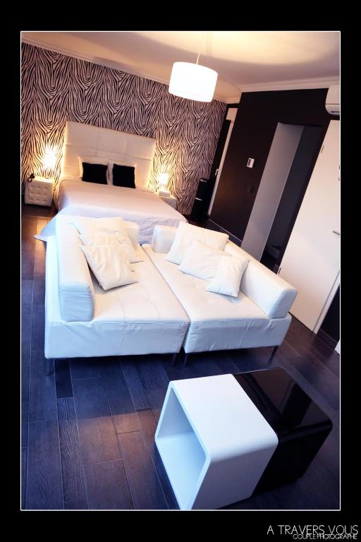 Postel nebo postele na pokoji v ubytování V E R O N E - Rooms & Suites - Liège - Rocourt