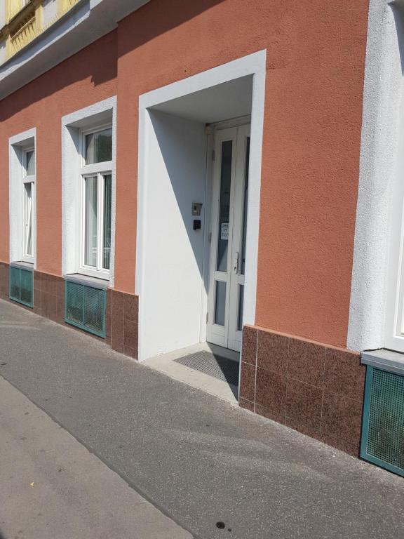 an open doorway to a building with a white door at Pension am Wienfluss in Vienna