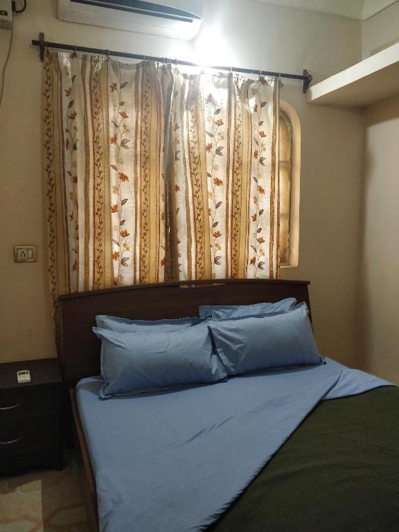 Postel nebo postele na pokoji v ubytování Koito-House calangute guest house