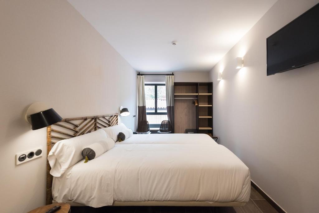 Postel nebo postele na pokoji v ubytování Hotel Rural Sagarlore
