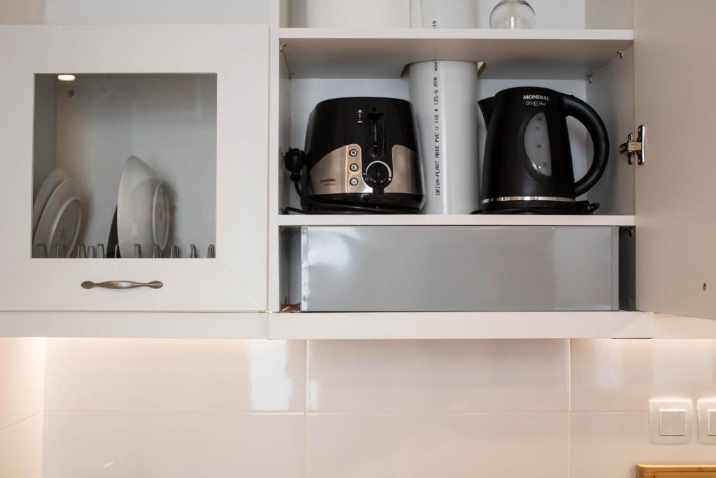 A kitchen or kitchenette at Super Stylish Apartments in Syntagma Square!