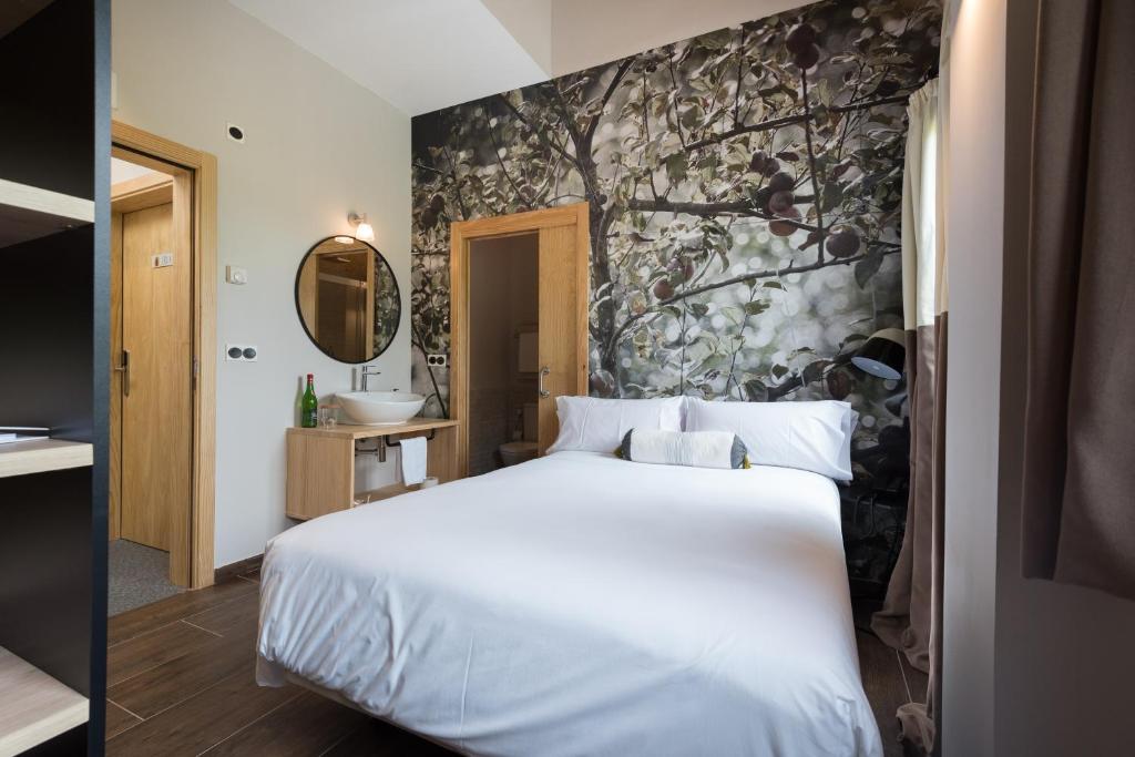 Postel nebo postele na pokoji v ubytování Hotel Rural Sagarlore