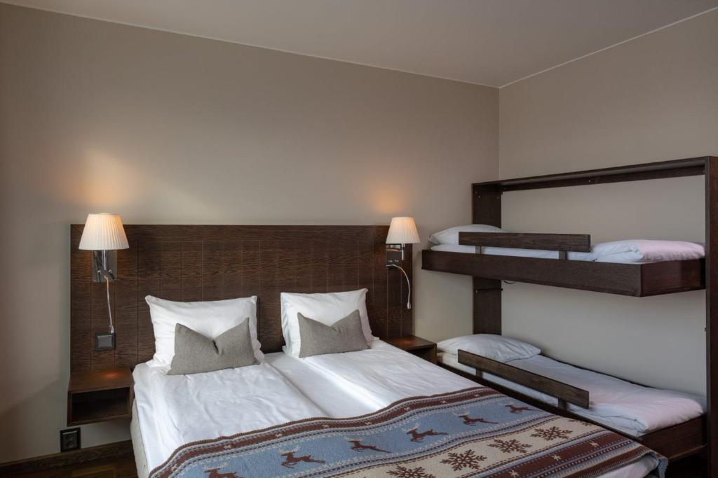 Postel nebo postele na pokoji v ubytování Quality Hotel Skifer