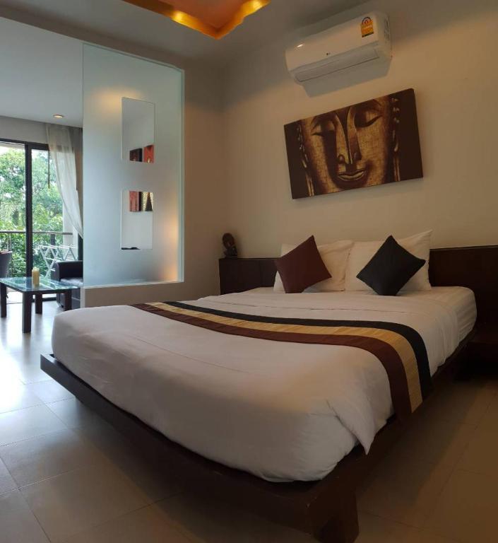 Postel nebo postele na pokoji v ubytování TSE Residence [by Samui Emerald]