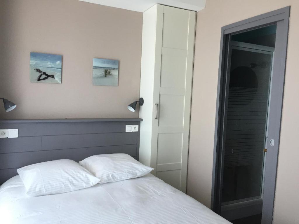Postel nebo postele na pokoji v ubytování Le Cannier Hotel