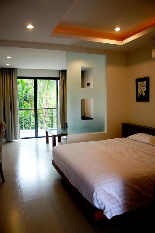 Postel nebo postele na pokoji v ubytování TSE Residence [by Samui Emerald]