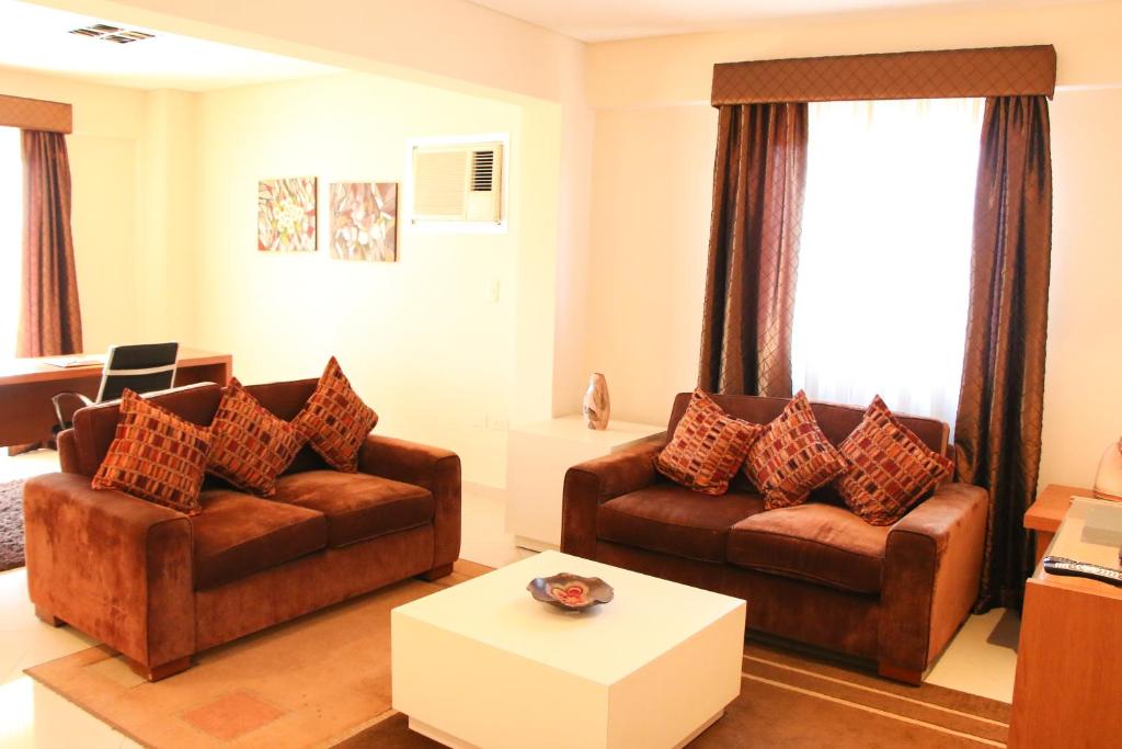 Χώρος καθιστικού στο Olimpo Hotel & Suites