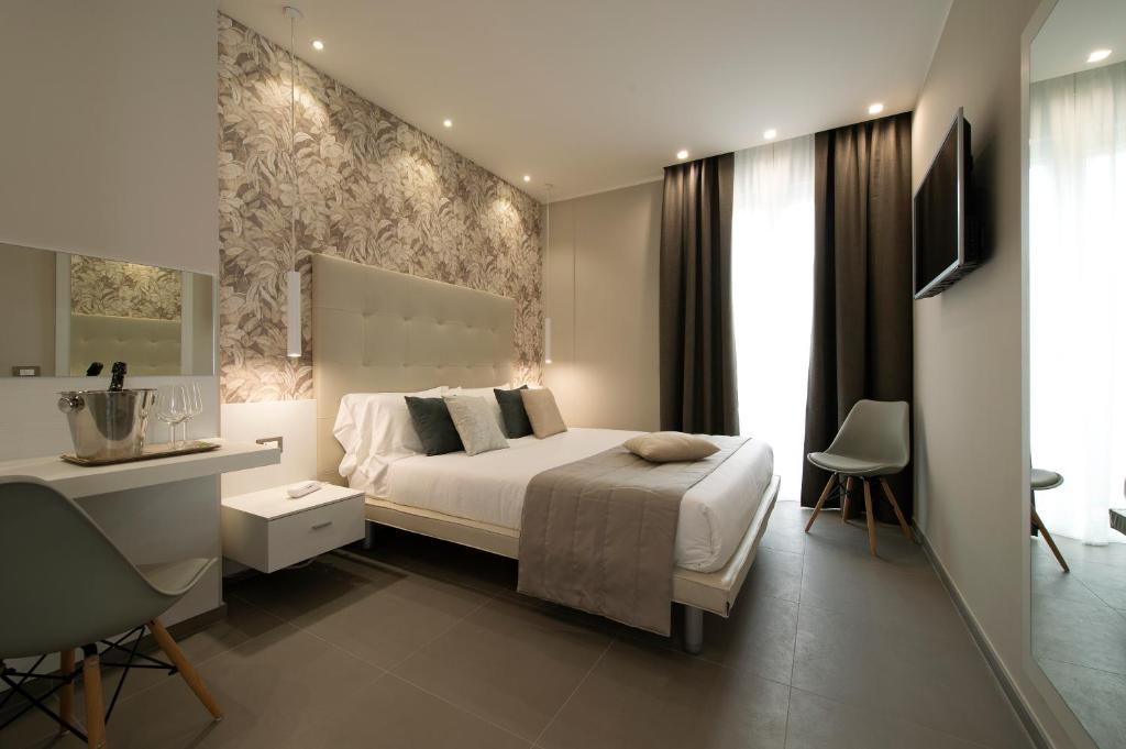 Postel nebo postele na pokoji v ubytování Hotel H21