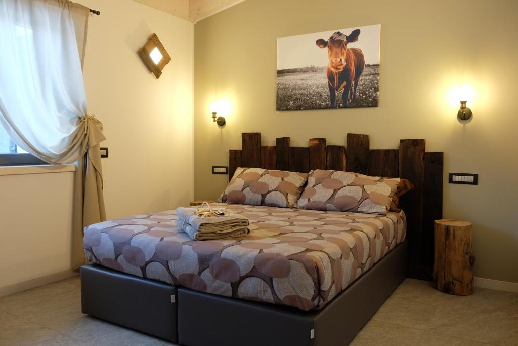 Postel nebo postele na pokoji v ubytování Arbulé Agriturismo & Spa Valtellina