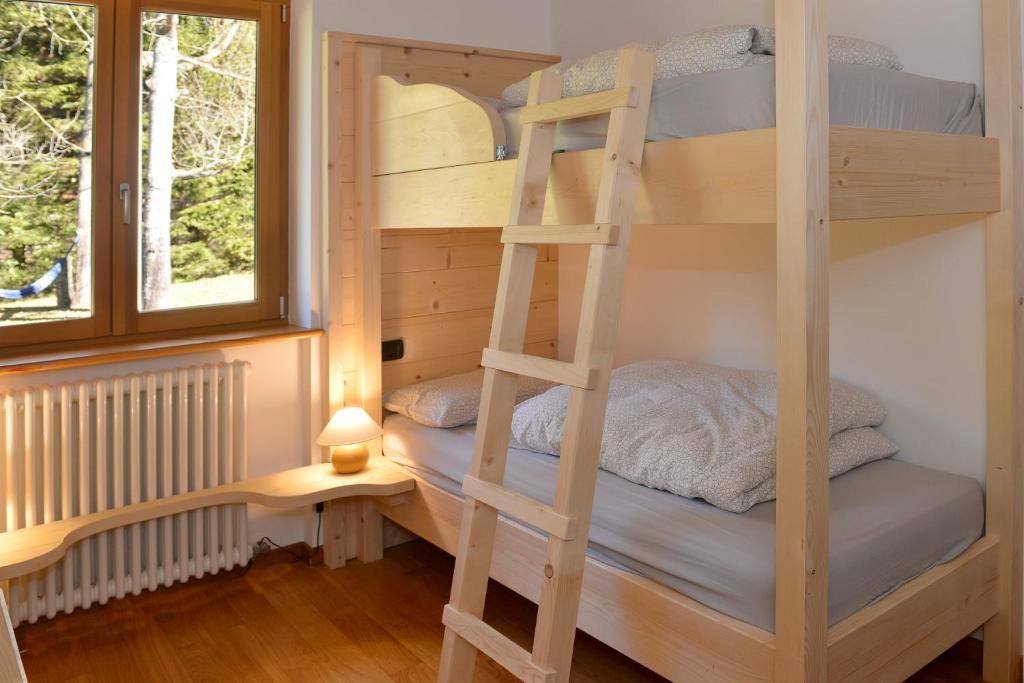 Postel nebo postele na pokoji v ubytování Andalo Chalet