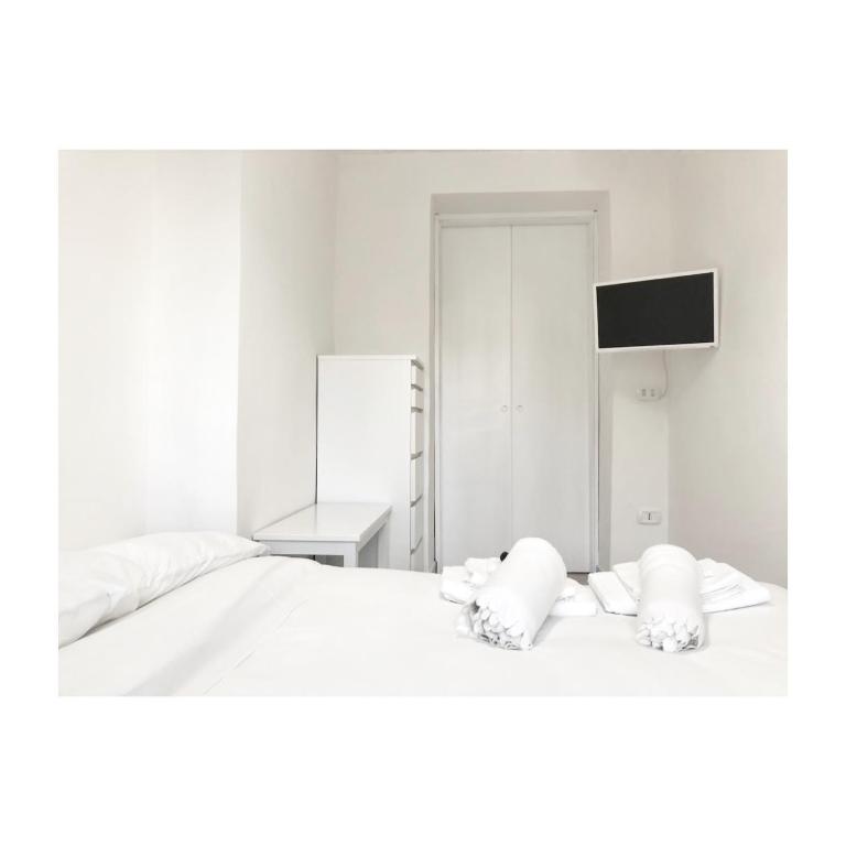 Łóżko lub łóżka w pokoju w obiekcie Secret Room Naples