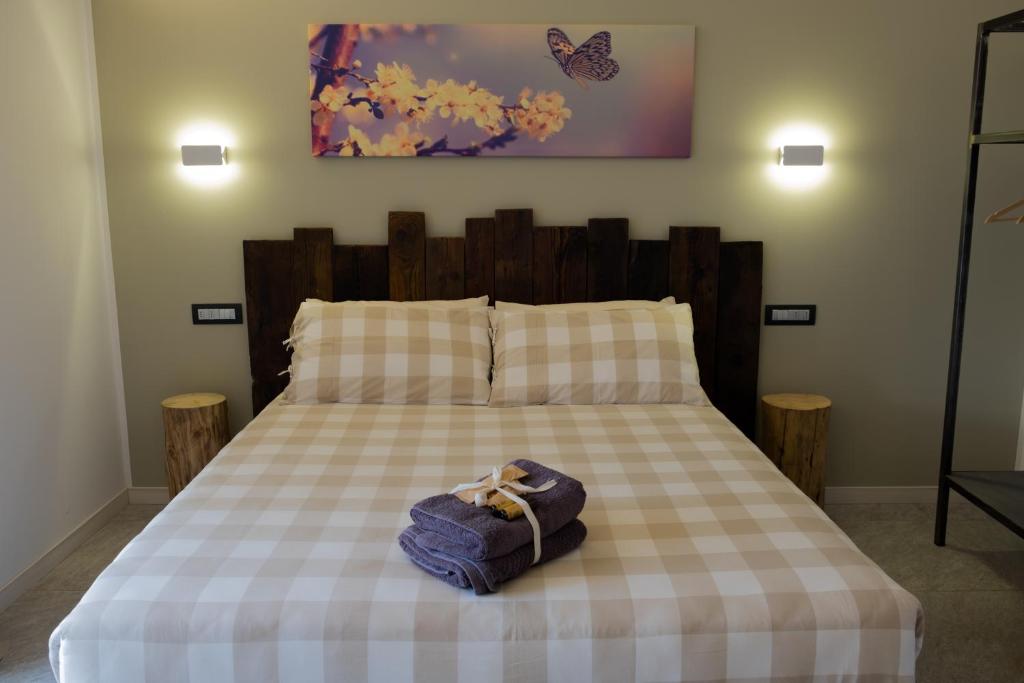 Postel nebo postele na pokoji v ubytování Arbulé Agriturismo & Spa Valtellina