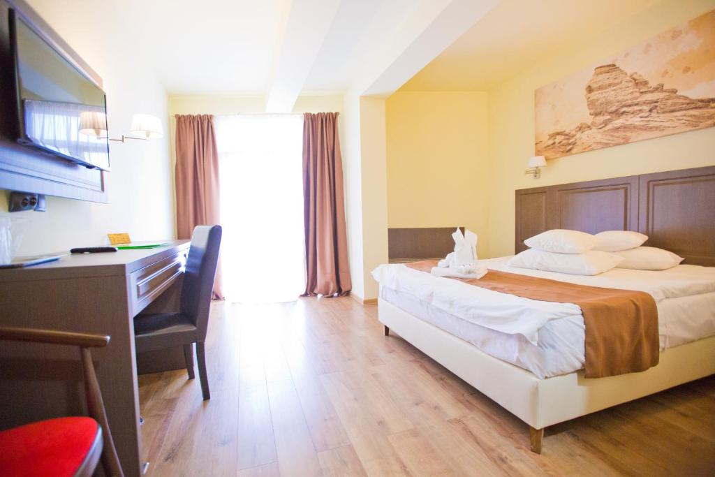 Postel nebo postele na pokoji v ubytování Hotel Piemonte