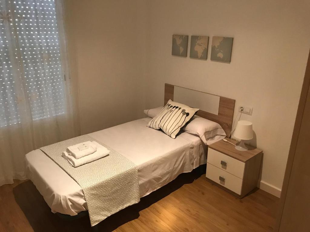 Posteľ alebo postele v izbe v ubytovaní Piso Aurora