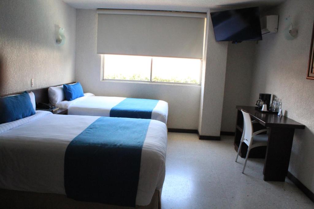 Postel nebo postele na pokoji v ubytování Hotel Ros Gaud