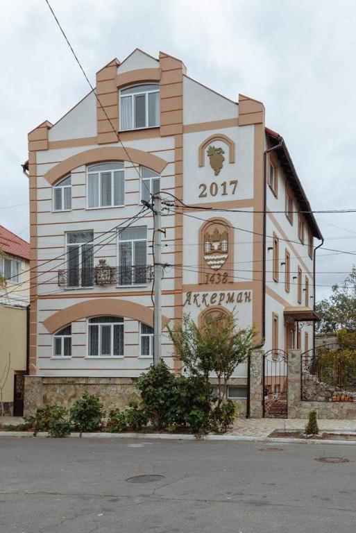 a building with a sign on the side of it at Бутик 2017 in Bilhorod-Dnistrovskyi
