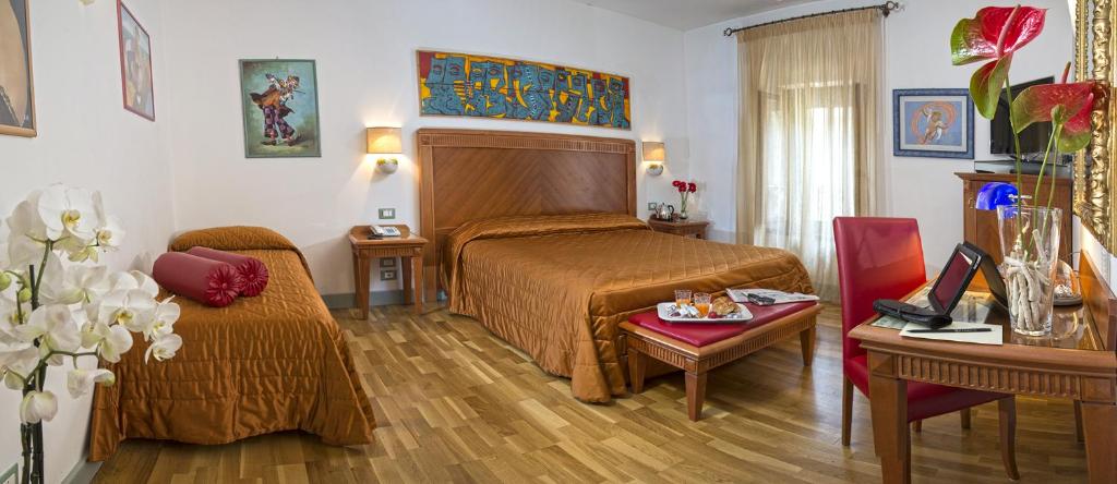 Postel nebo postele na pokoji v ubytování Boutique Hotel al Grappolo d'Oro