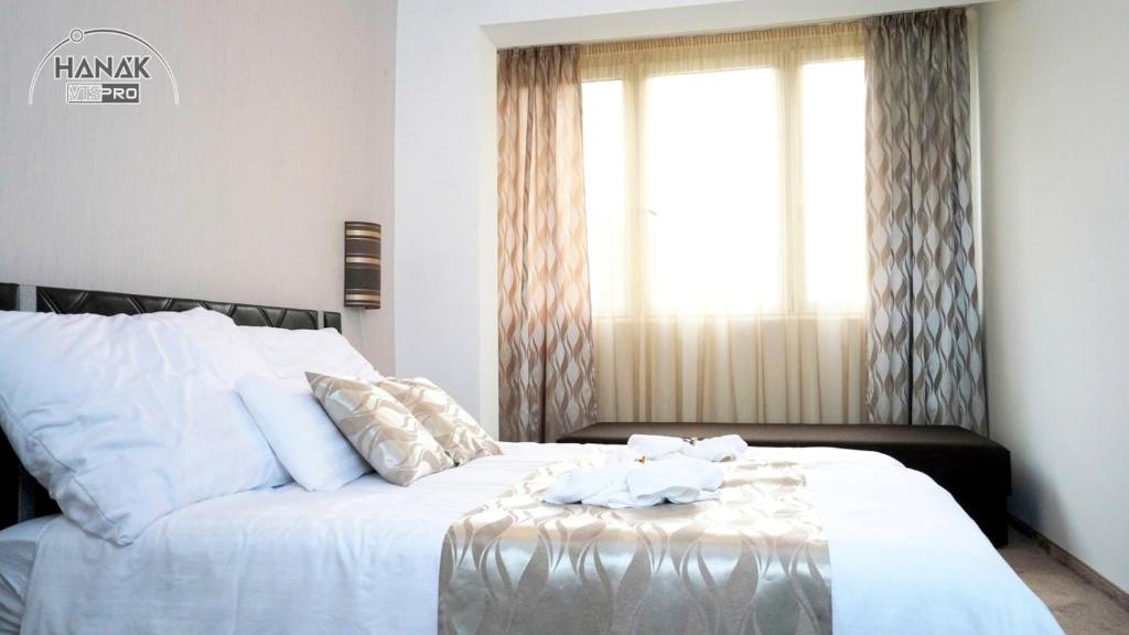 Postel nebo postele na pokoji v ubytování Hotel Írisz