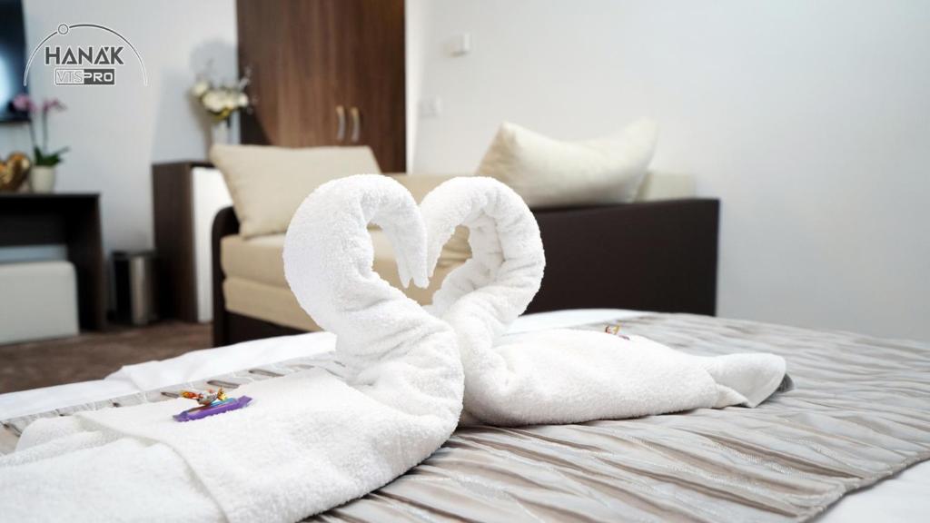 Postel nebo postele na pokoji v ubytování Hotel Írisz