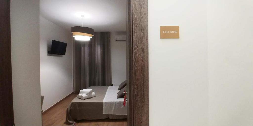 Postel nebo postele na pokoji v ubytování B&B Il Campanile