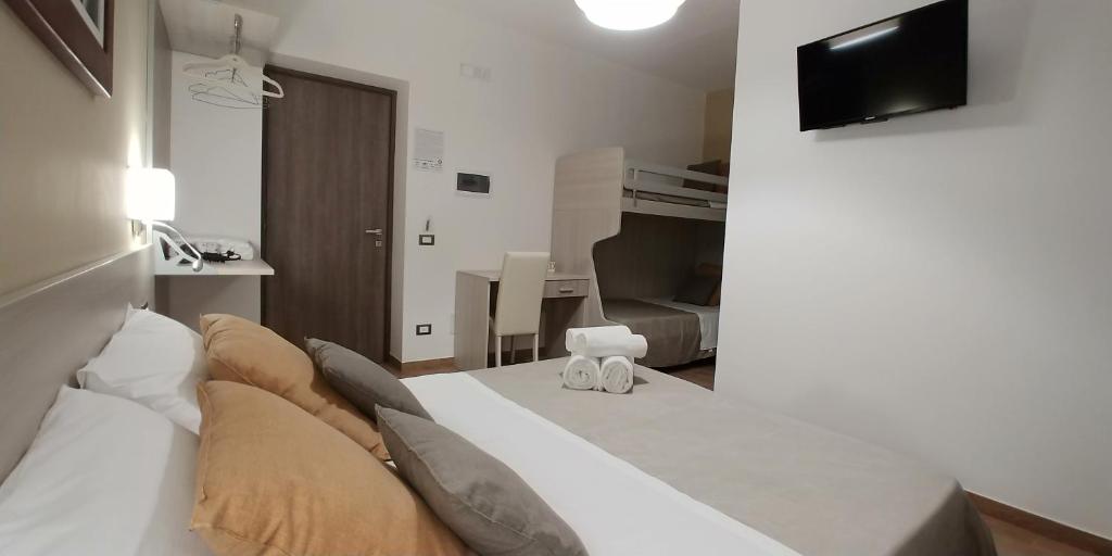 Postel nebo postele na pokoji v ubytování B&B Il Campanile