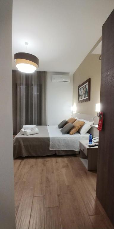Postel nebo postele na pokoji v ubytování B&B Il Campanile
