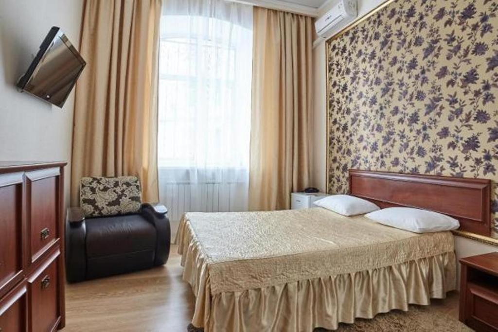 Кровать или кровати в номере Отель Бонжур на Казакова