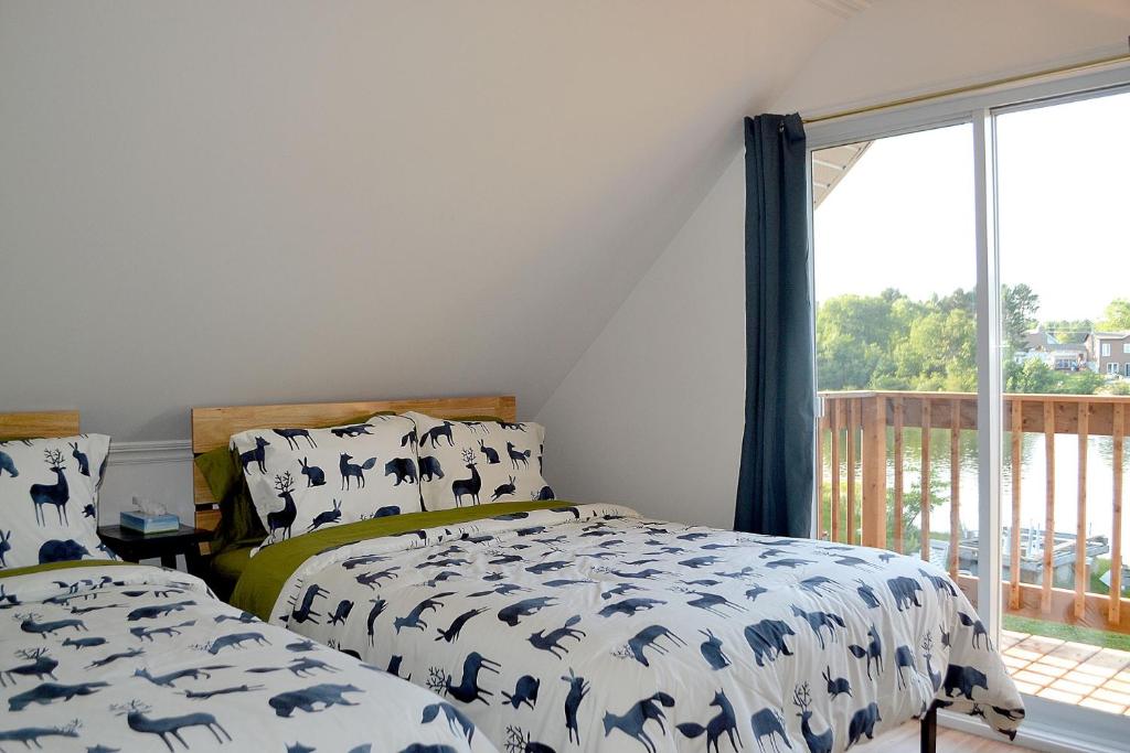 Postel nebo postele na pokoji v ubytování Les 4 chalets - Le 609