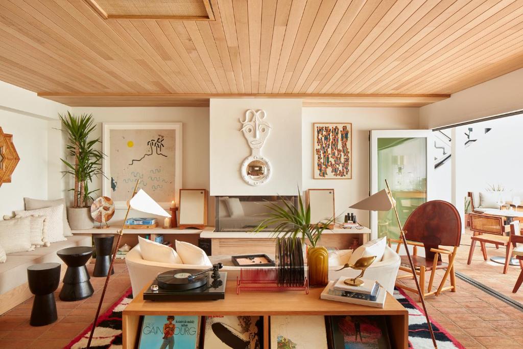 a living room with a wooden ceiling at Hotel Joaquin - Adults Only in Laguna Beach