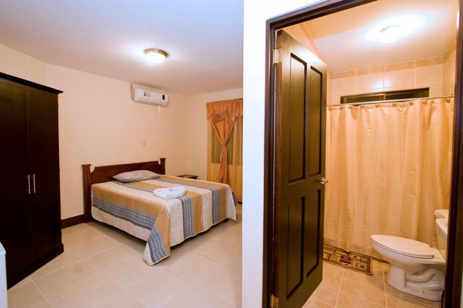 Postel nebo postele na pokoji v ubytování Hotel El Cerro