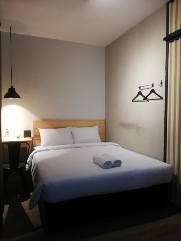 Ένα ή περισσότερα κρεβάτια σε δωμάτιο στο PINX'S HOSTEL