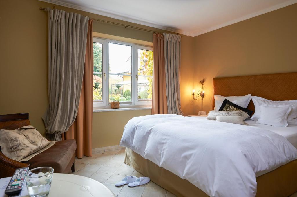 Postel nebo postele na pokoji v ubytování Hotel VILLINO