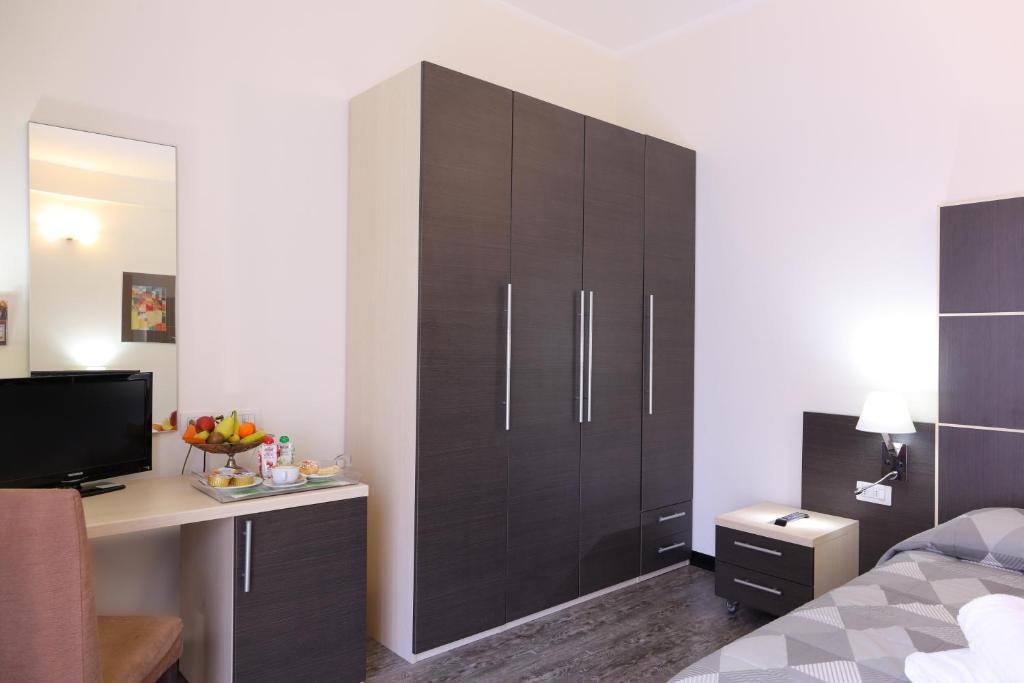 TV a/nebo společenská místnost v ubytování Hotel Ferrari