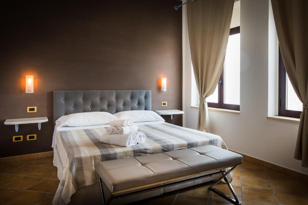 En eller flere senger på et rom på Villa Santadi