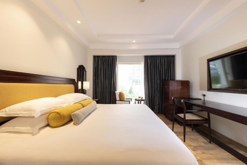 Postel nebo postele na pokoji v ubytování Taj Samudra, Colombo