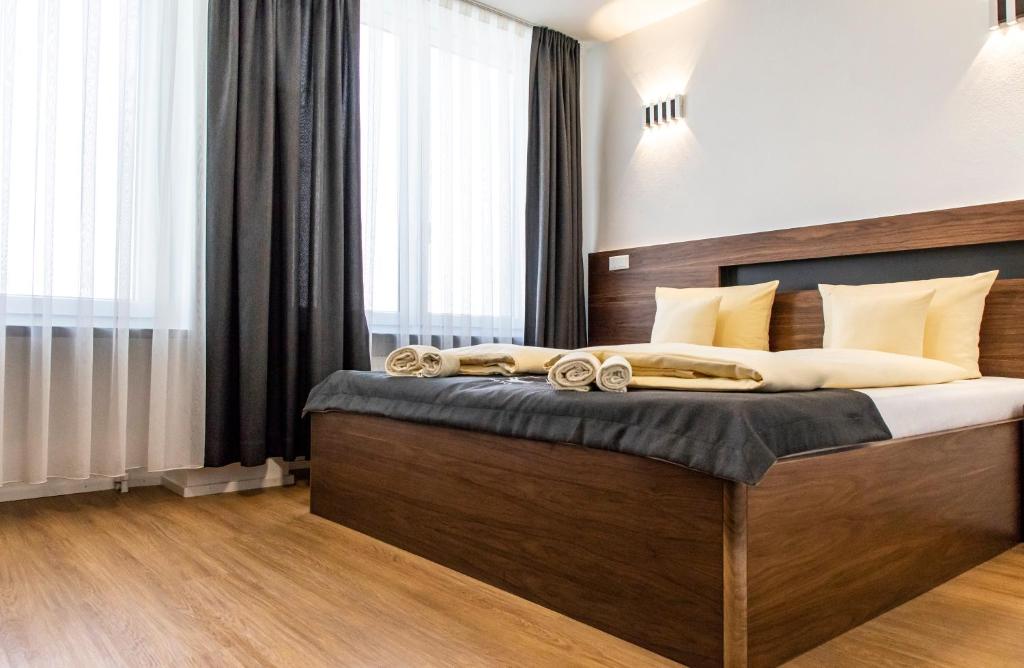Säng eller sängar i ett rum på Hotel Jägerhaus