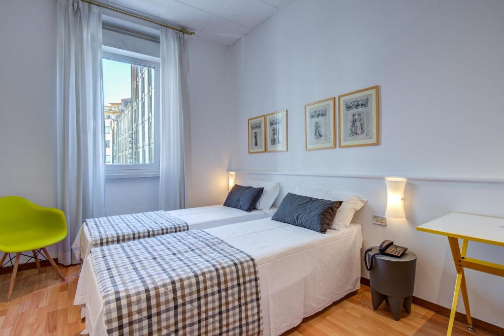 Postel nebo postele na pokoji v ubytování Hotel Bernina